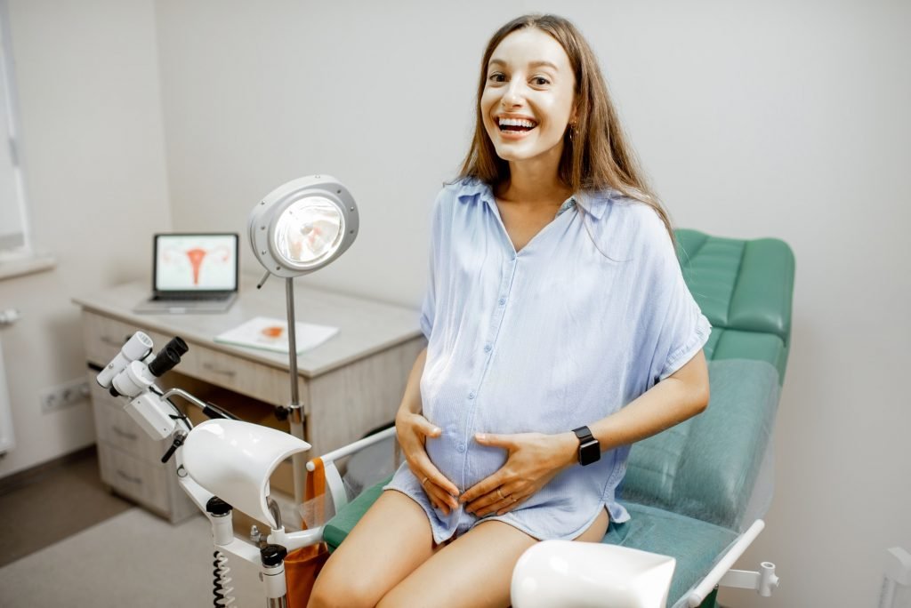 Pregnant woman on the gynecological chair
